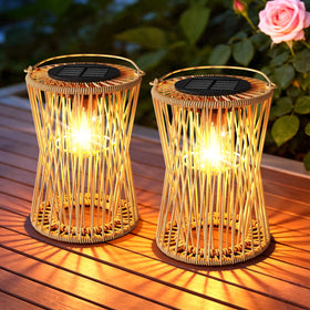 AOUNQ solar lantern with vintage rattan weave casting warm amber light outdoors.