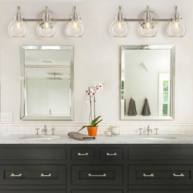 Apenath globe-clear-glass shade wall sconce ideal for bathrooms and entryways.
