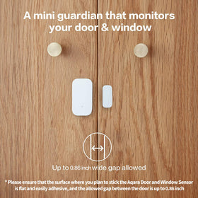 Aqara door-window sensor placed near a window demonstrates gap tolerance for reliable detection.