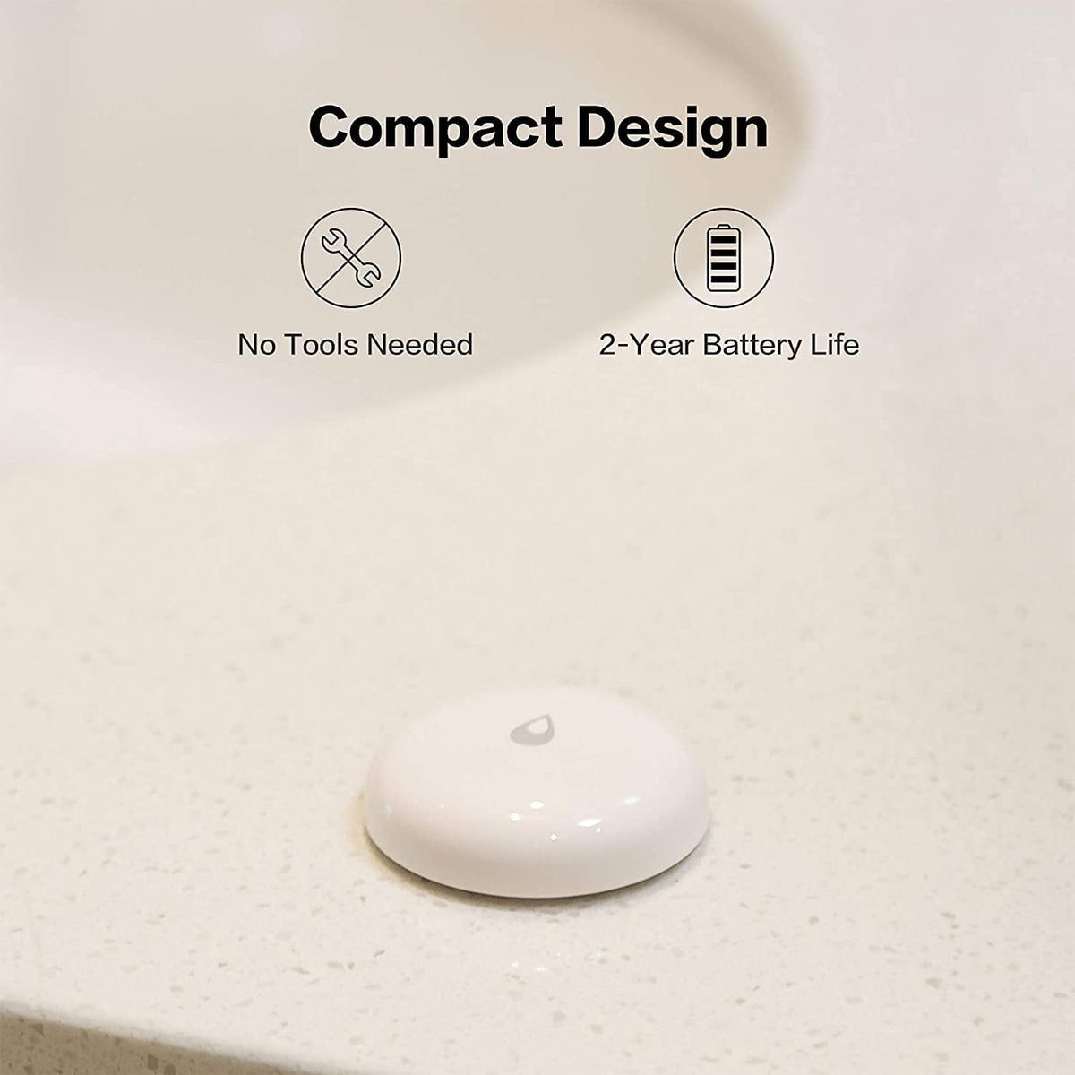 Aqara Water Leak Sensor installed under kitchen sink for monitoring.