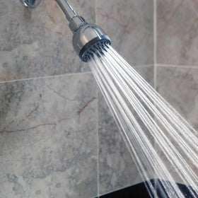 Aqua Elegante shower head in use delivering steady water flow