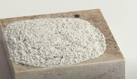 Aqua Mix Poultice Stain Remover dry clay paste demonstrates non-scrub deep-clean on surfaces.