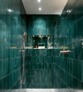 AQUAIAW wall union with handheld shower holder mounted for easy access.