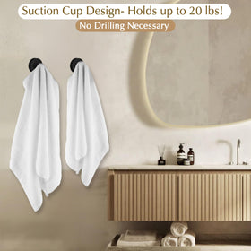ARBELLE INNOVATIONS brushed gold suction cup hook gripping a loofah securely