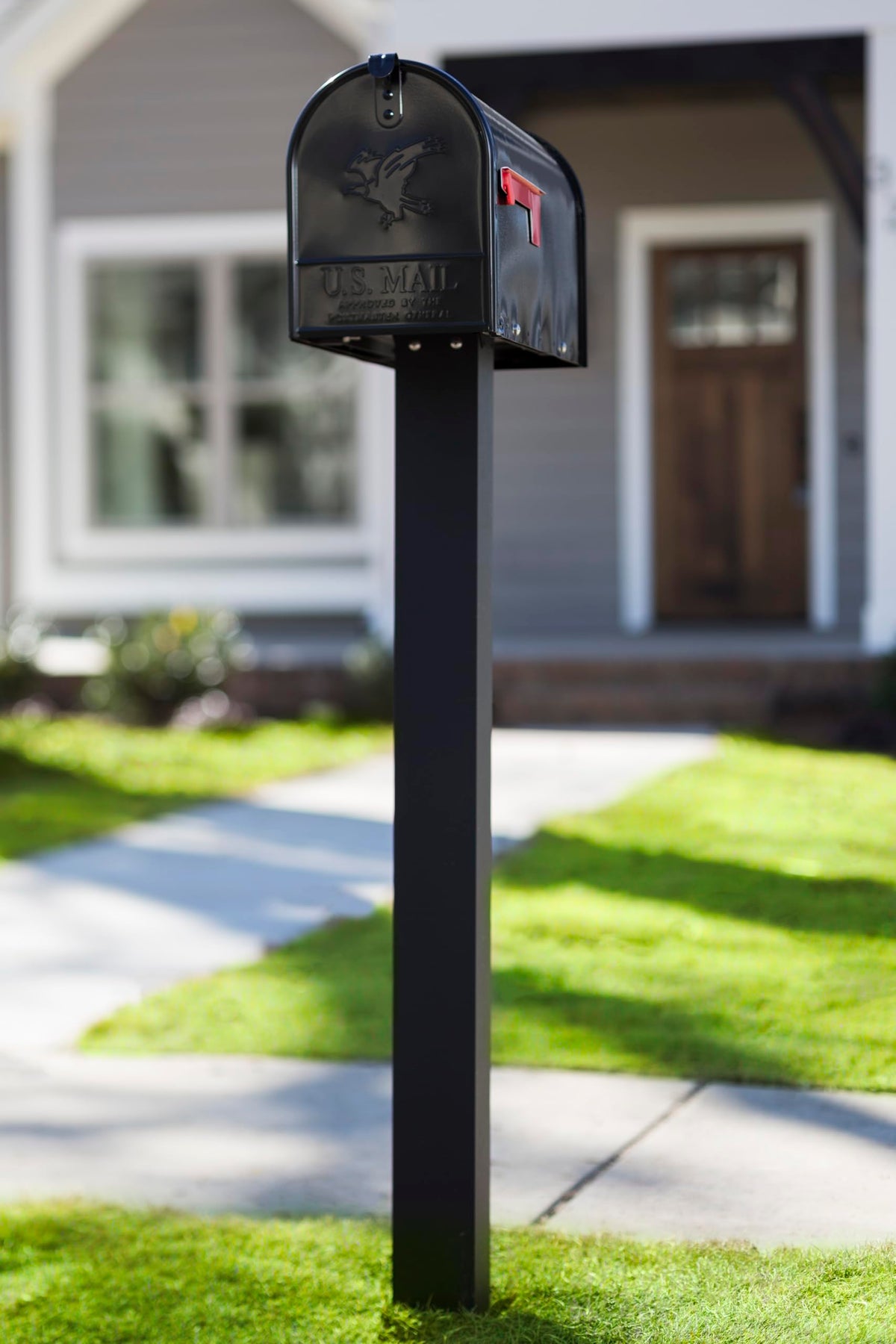 Brighton post installed in-ground for a stable curbside display.