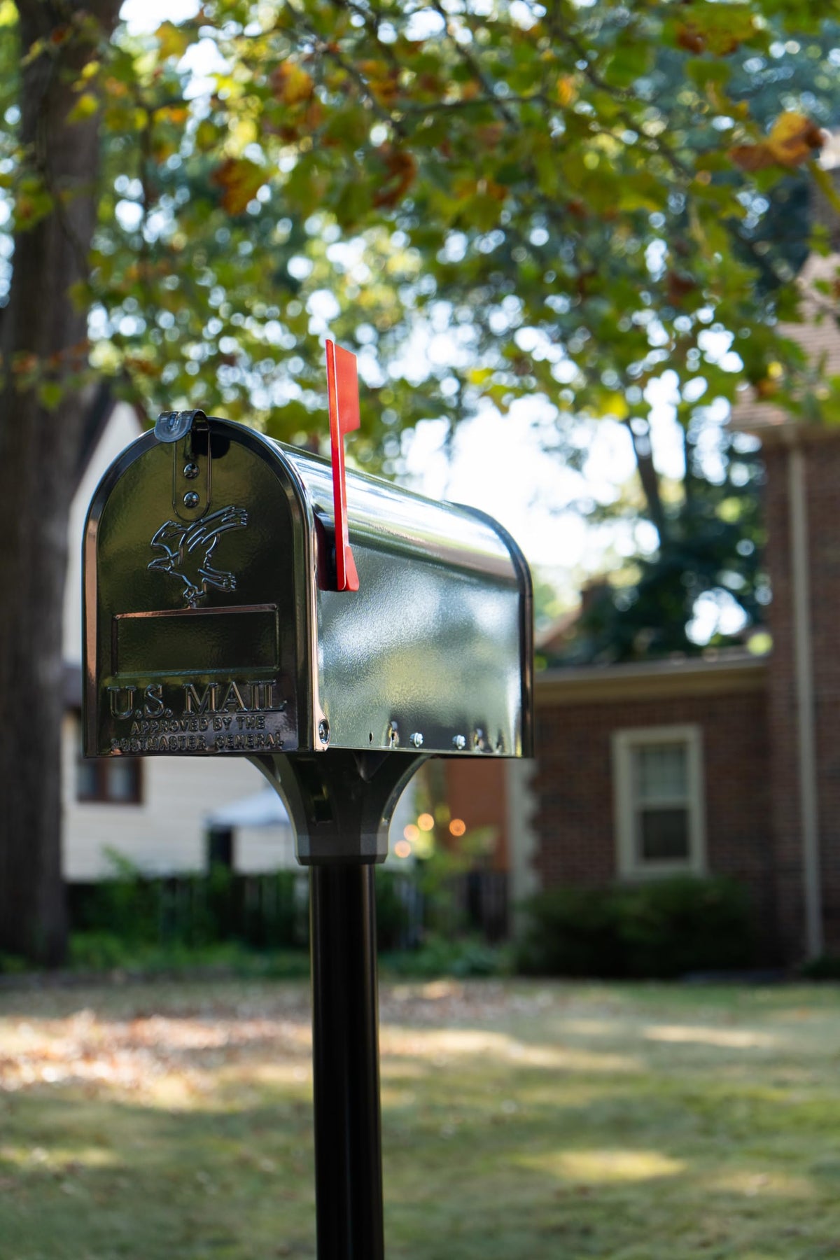 Architectural Mailboxes Coolidge post with mailbox mount creates a cohesive curbside look.
