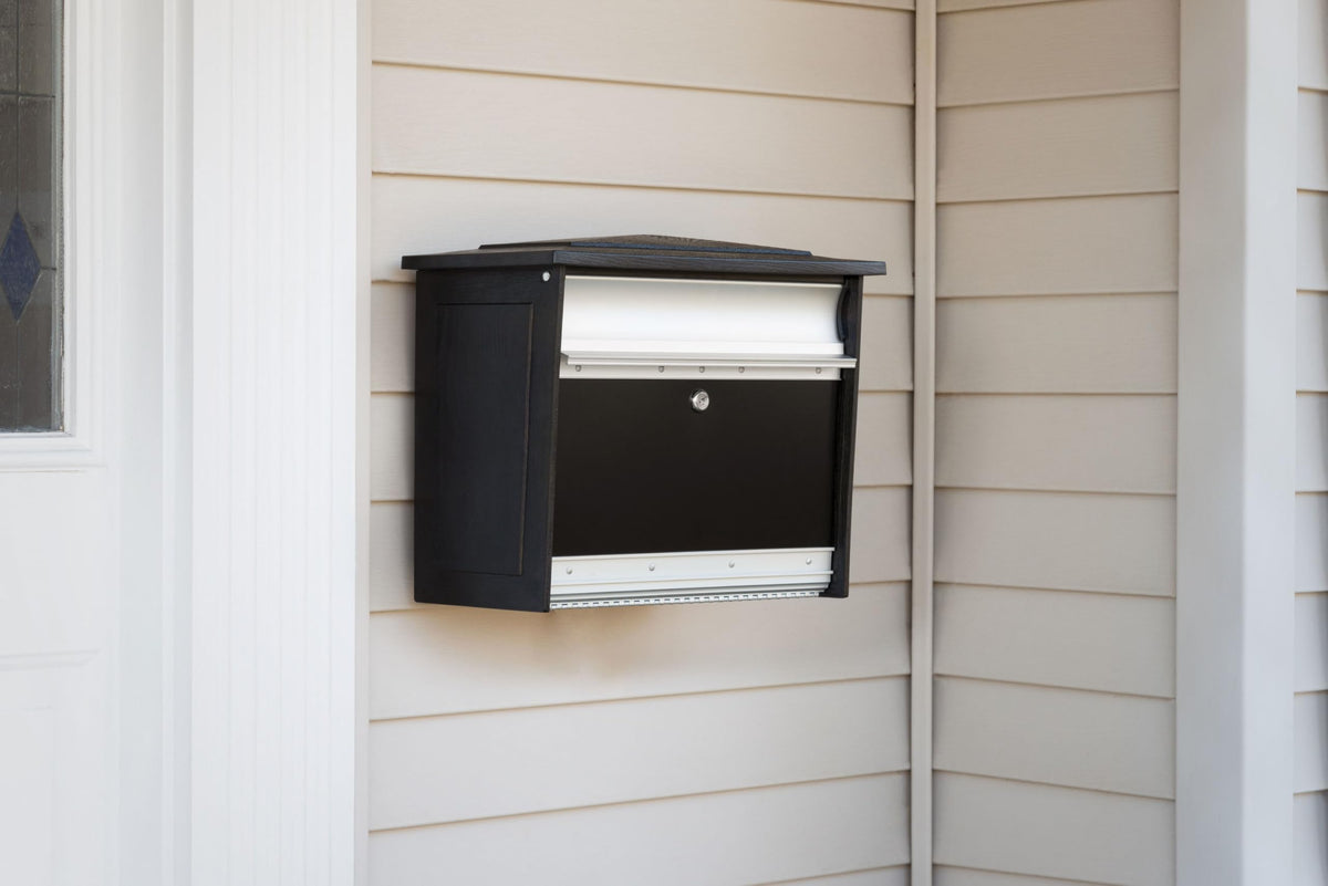 ARCHITECTURAL MAILBOXES Mailsafe black finish blends with modern exteriors.