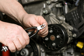 Automotive scene using ARES safety wire tool on a vehicle.