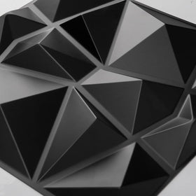 Art3d matte-black diamond panel under soft lighting for moody ambiance.