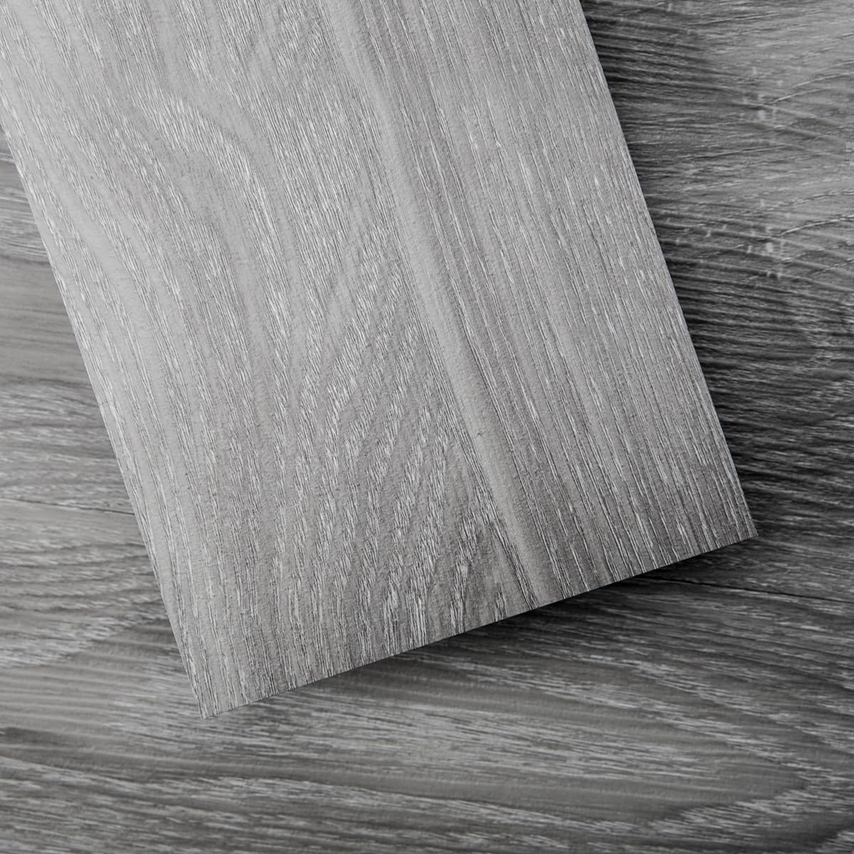 Art3d Peel and Stick Floor Tile with light grey wood grain finish.