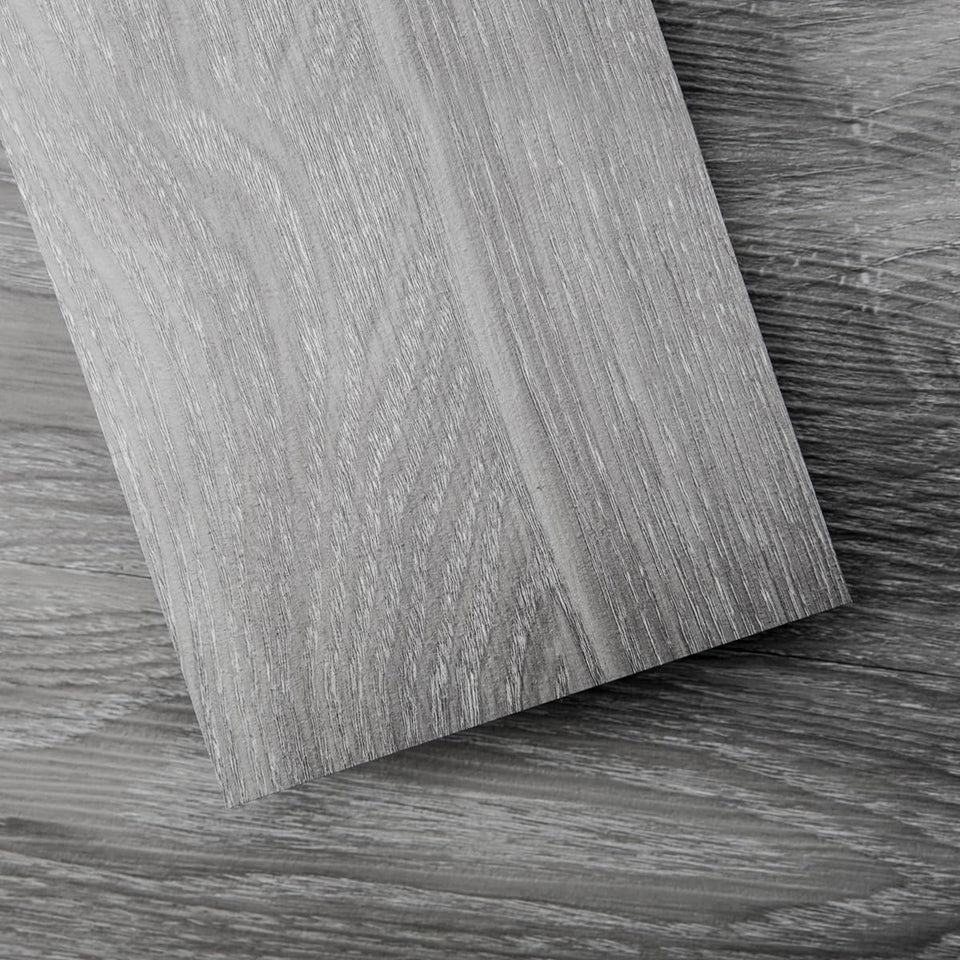 Art3d Peel and Stick Floor Tile with light grey wood grain finish.