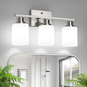Ascher 3-light vanity light over mirror with brushed nickel finish for even bathroom illumination.