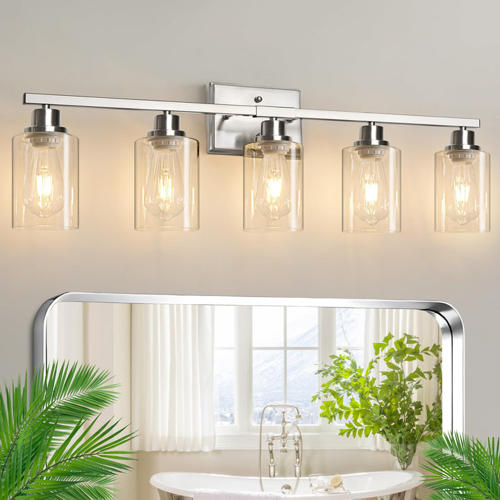 Ascher 5-light vanity with clear glass shades brightens bathroom mirrors effectively.