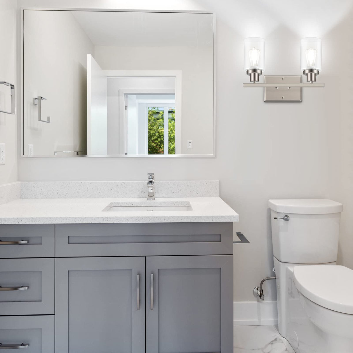 Ascher bathroom vanity light featuring clear glass shade for mirrors