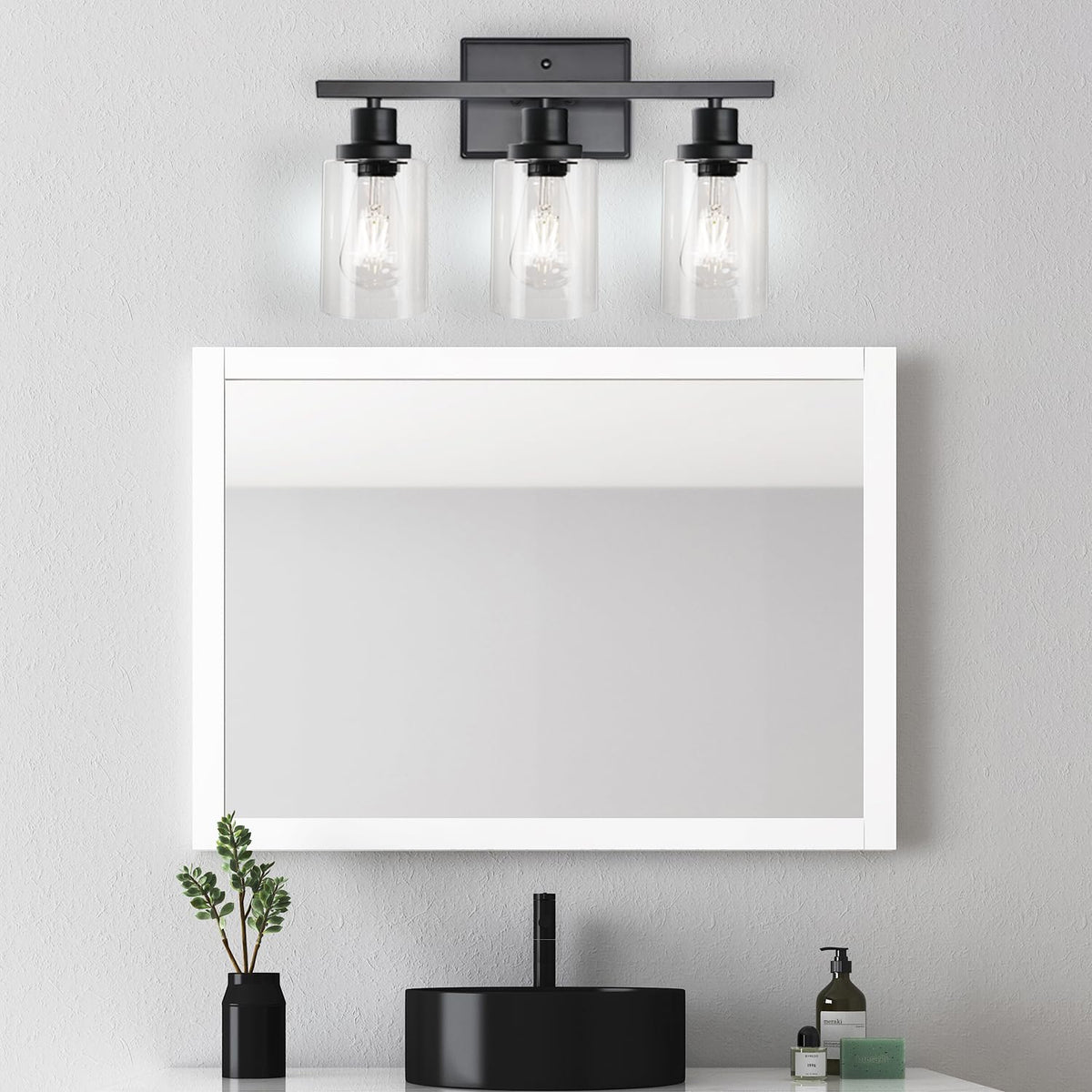Ascher glass shades diffuse soft illumination across mirrors and countertops.