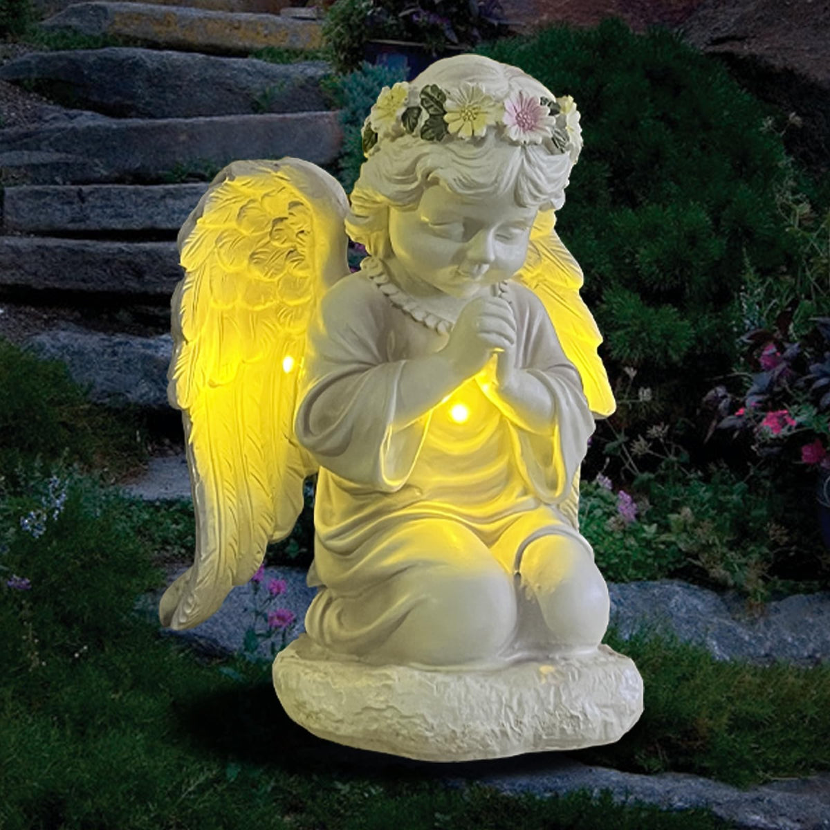 ASDFG solar garden angel statue bathed in sun, adds whimsical outdoor charm.