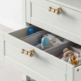 Asidrama knob installed on a drawer demonstrating the standard screw spacing