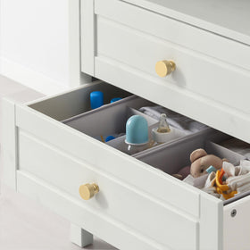 Asidrama brushed gold drawer knobs installed on a dark dresser for contrast