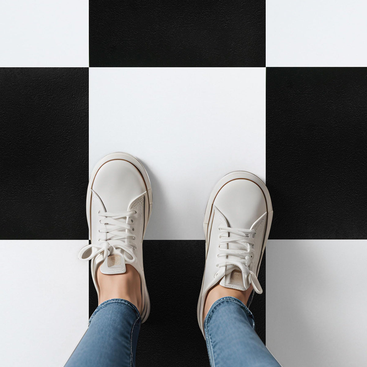 Asstinous checkered tiles on kitchen floor showing bold black and white pattern and durability.