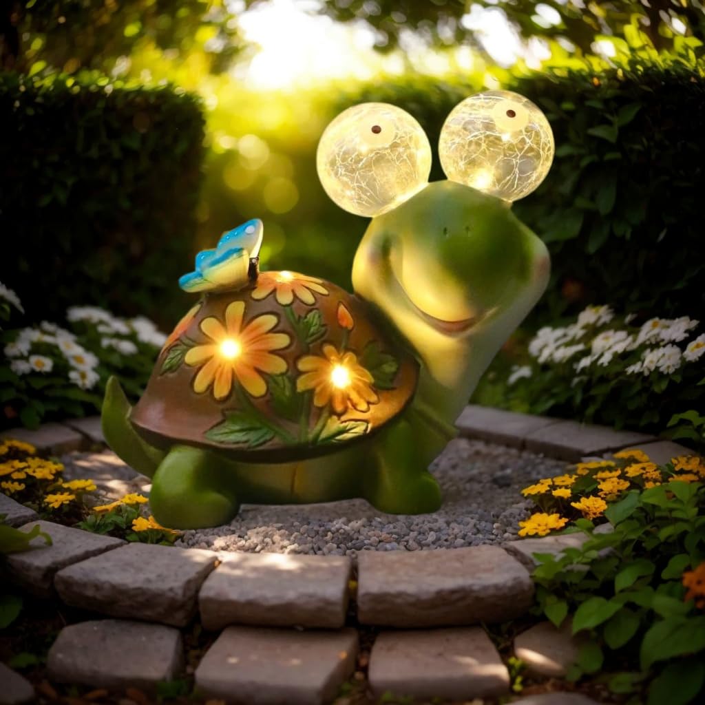 ASTRAEUS solar turtle statue front view glows softly, enhancing outdoor ambiance.