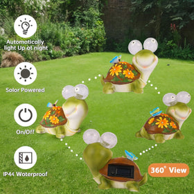 ASTRAEUS turtle statue in garden creates inviting night-time ambiance.
