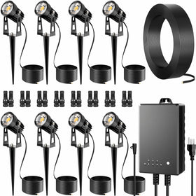 AUDERWIN all-in-one outdoor low voltage spotlights illuminate the yard with a warm 3000K glow.