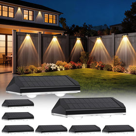 AUDLES solar fence lights in warm mode creating cozy outdoor ambience along the fence.