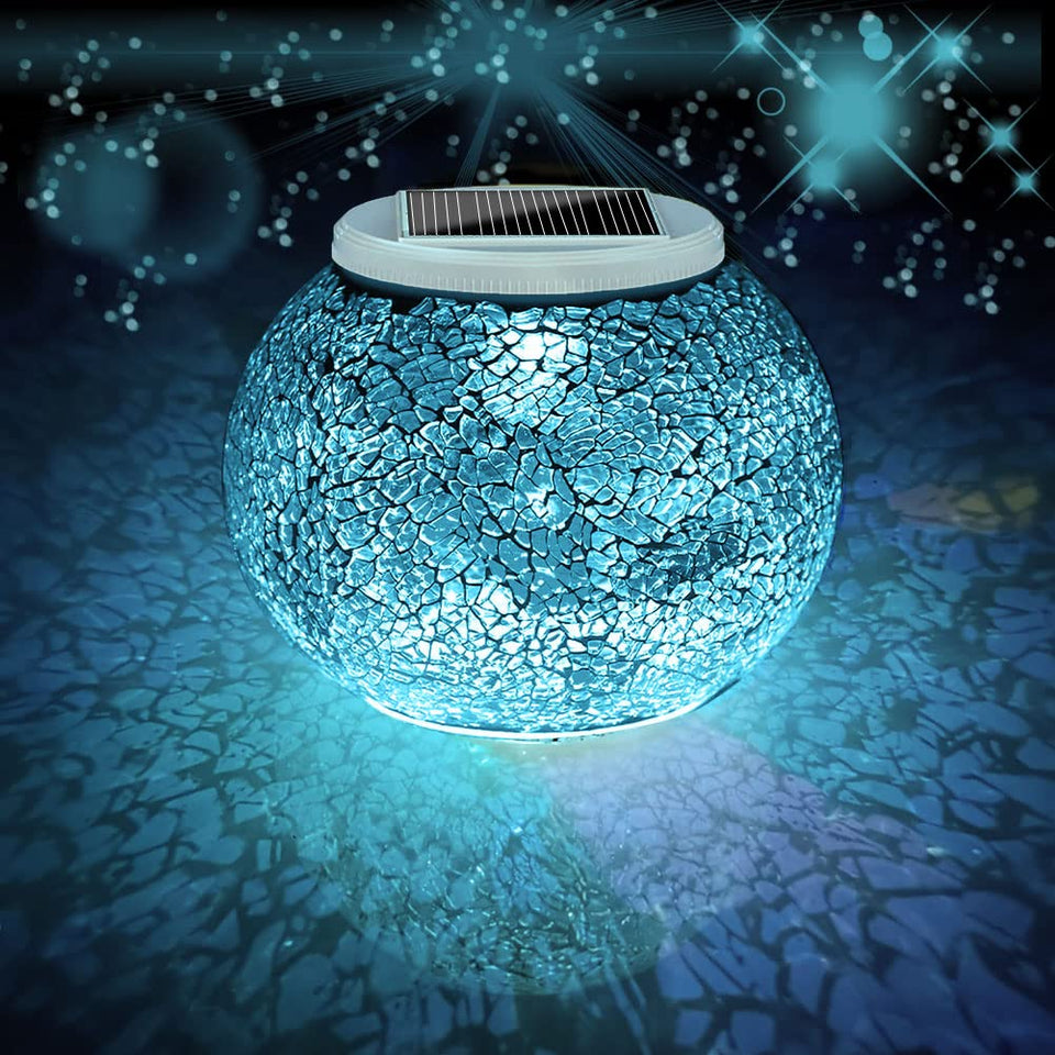 Aukora crack glass ball light glows at dusk, creating romantic outdoor ambiance.
