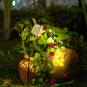 AWENDIETOU outdoor solar lantern glows with warm, wire-free ambience.