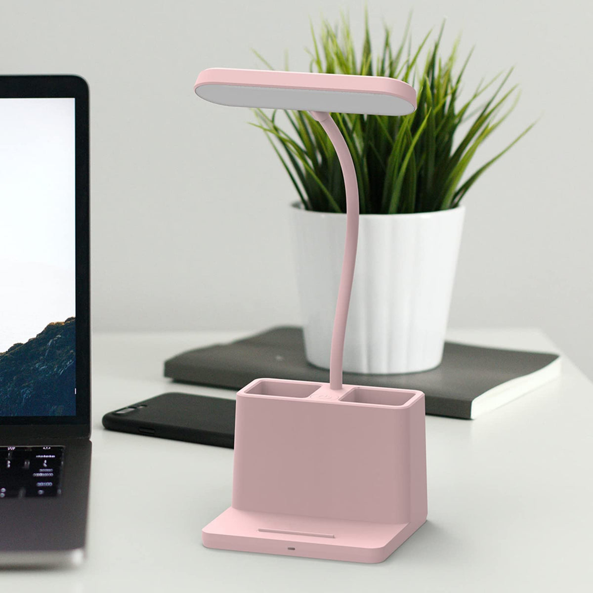 AXX Pink gooseneck desk light offers flexible angle for tailored illumination.