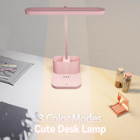 AXX pink desk lamp includes built-in pen holder keeping stationery within reach.
