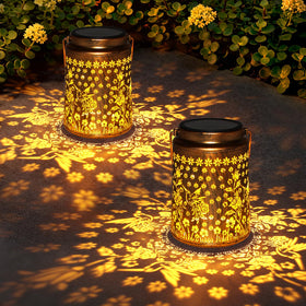 Babineto solar lantern with hummingbird and rose design casting a warm glow