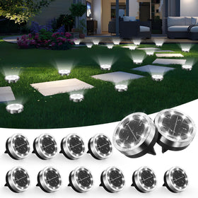 Banbanjo solar ground light disk in stainless steel marks garden paths at night