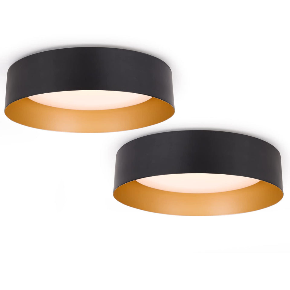 Bargeni flush mount light front view with matte black exterior and champagne interior.