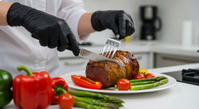 Basic Synmax black vinyl exam gloves suited for lab use.