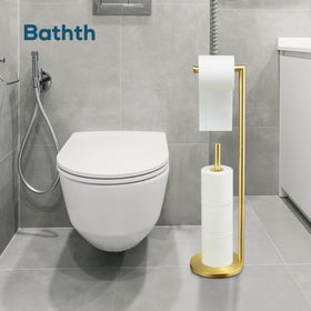 Bathth gold toilet paper holder stand with three spare rolls stored nearby