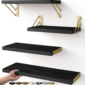 BAYKA floating shelves in black gold displaying decor in a stylish living room