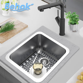 BEHOK silicone sink mat gray in-use under dishes cushions impact and protects surfaces.