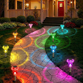 Benany solar mushroom light illuminating a garden path with color-changing glow.