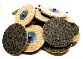 Benchmark Abrasives 3-inch quick-change sanding disc in use for deburring metal.