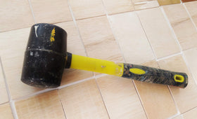 Benchmark rubber mallet fiberglass handle close-up showing strong lightweight grip