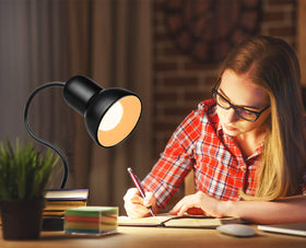 Beser·Win clip-on reading light mounted on a desk or bed.