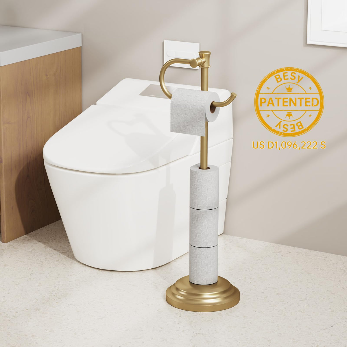 BESy brushed gold toilet paper roll holder showcases elegant storage.