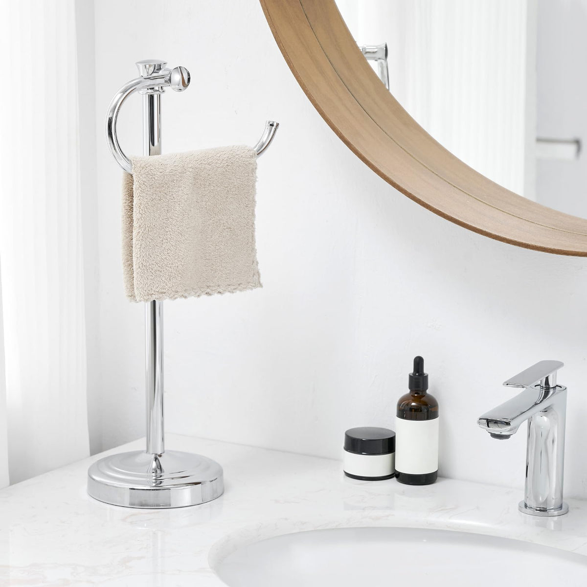 BESy free-standing polished chrome towel bar on a vanity surface