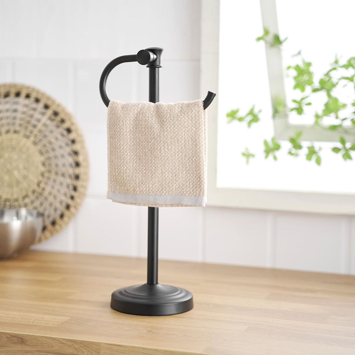 Towel bar placed on a bathroom vanity as a decor focal point.