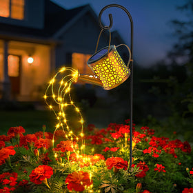 BETOLEAN solar watering can light on patio creates a romantic glow for evenings