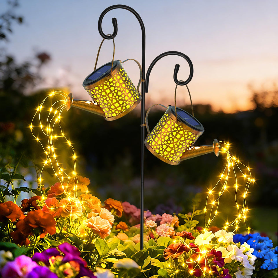 BETOLEAN solar watering can light outdoor with flowing star glow along the garden path.