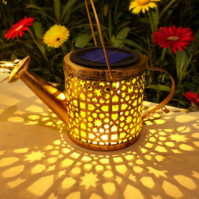 BETOLEAN solar watering can lights along garden pathway illuminate the walk