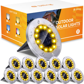 Biling solar ground light with 12 LEDs showing a warm yellow glow along a garden edge