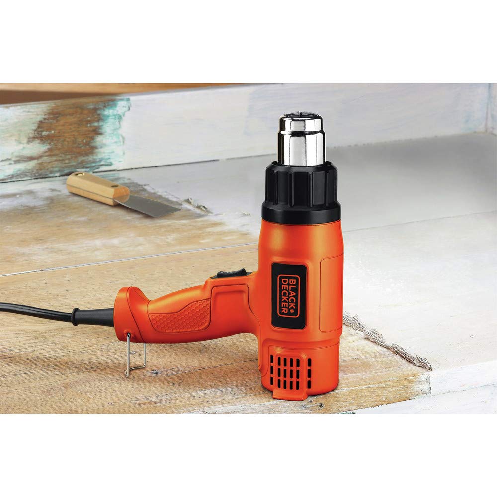 BLACK+DECKER HG1300 heat gun in action for paint stripping and rust removal.